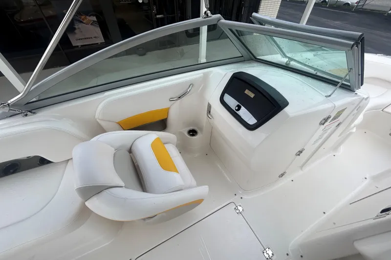 Slide: The Image of 2008 Chaparral Sunesta 244 boat interior with white and yellow seating. - 9