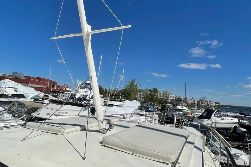Slide: The Image of 1978 Hatteras 43 Double Cabin in marina under clear blue sky. - 12