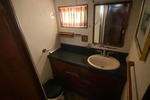 Slide: The Image of Interior of 1978 Hatteras 43 Double Cabin, bathroom with sink and mirror. - 15