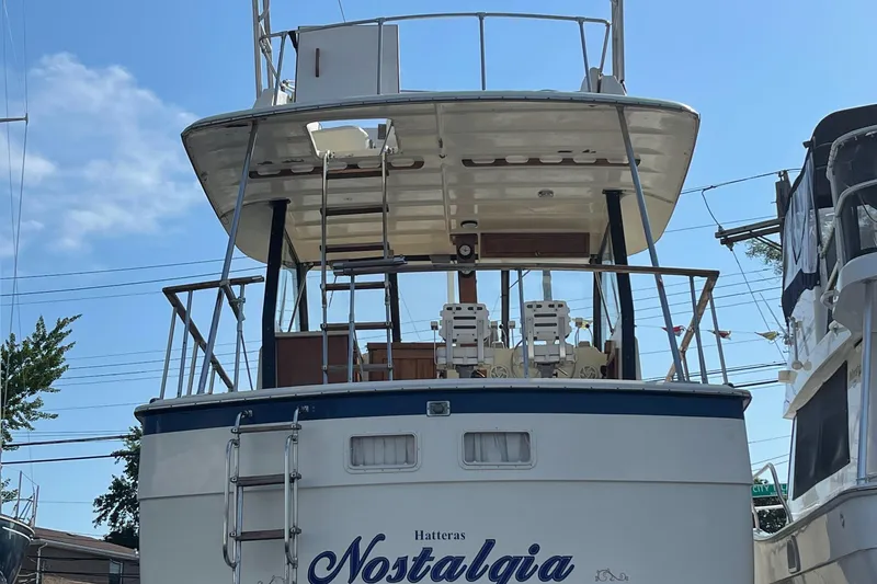 Slide: The Image of 1978 Hatteras 43 Double Cabin yacht docked in harbor. - 2