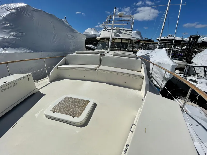 Slide: The Image of 1978 Hatteras 43 Double Cabin on a sunny dock. - 6