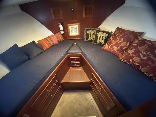 Slide: The Image of 1978 Hatteras 43 Double Cabin interior with cozy bedding. - 9