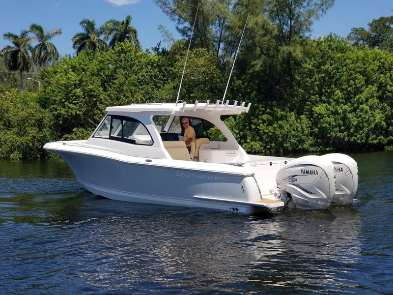 Slide: The Image of 2021 Southport 33 DC boat on calm water. - 1