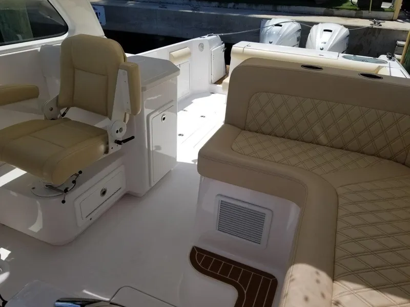 Slide: The Image of Interior of a 2021 Southport 33 DC boat with beige seating. - 7