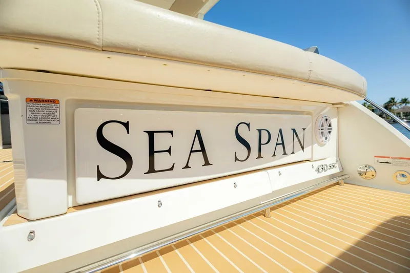 Slide: The Image of 2018 Formula 430 Super Sport Crossover boat with "Sea Span" nameplate, sunny deck view. - 15