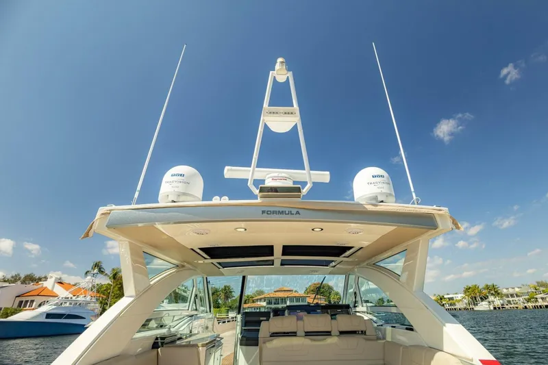 Slide: The Image of 2018 Formula 430 Super Sport Crossover yacht, featuring sleek design and advanced technology. - 16