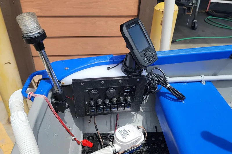 Slide: The Image of 1966 Sea Nymph V-14 boat dashboard with navigation equipment and control panel. - 5