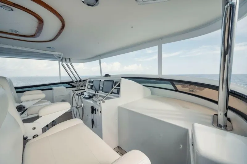 Slide: The Image of Luxurious helm of 2002 Westport 112 yacht with ocean view and modern controls. - 38