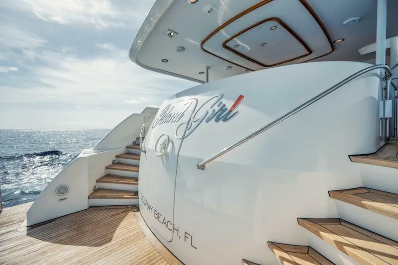 Slide: The Image of Luxury yacht "112 Westport" with elegant design, ocean view, and wooden deck stairs. - 33