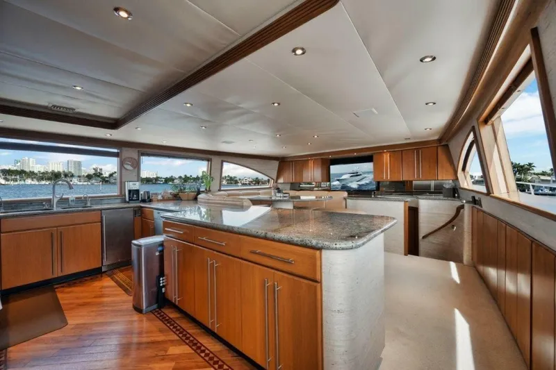 Slide: The Image of Luxurious kitchen interior of 2002 Westport 112 yacht with wood cabinetry and ocean views. - 27