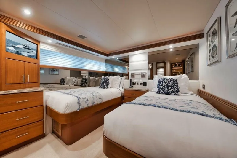 Slide: The Image of Luxurious twin bedroom on 2002 Westport 112 yacht, featuring elegant decor and modern amenities. - 24