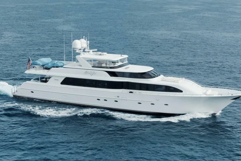 The Image of Luxurious 2002 Westport 112 yacht cruising on open sea. - 1