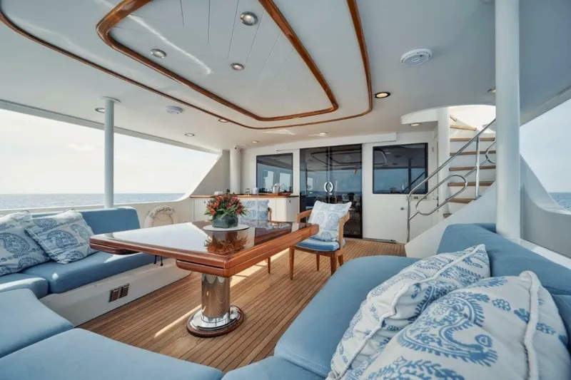 Slide: The Image of Luxurious 2002 Westport 112 yacht interior with elegant seating and ocean view. - 32