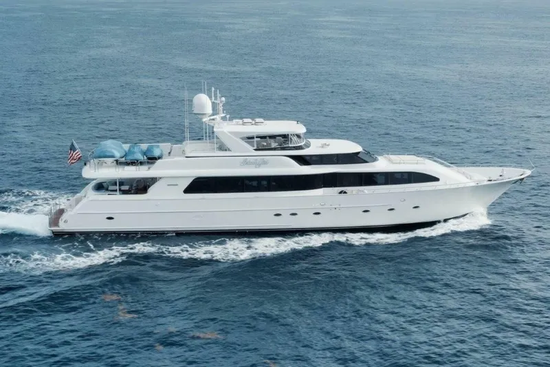 Slide: The Image of Luxury 2002 Westport 112 yacht cruising on open sea, displaying sleek design and elegance. - 43