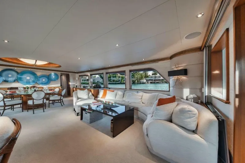 Slide: The Image of Luxurious interior of 2002 Westport 112 yacht with elegant seating and dining area. - 15