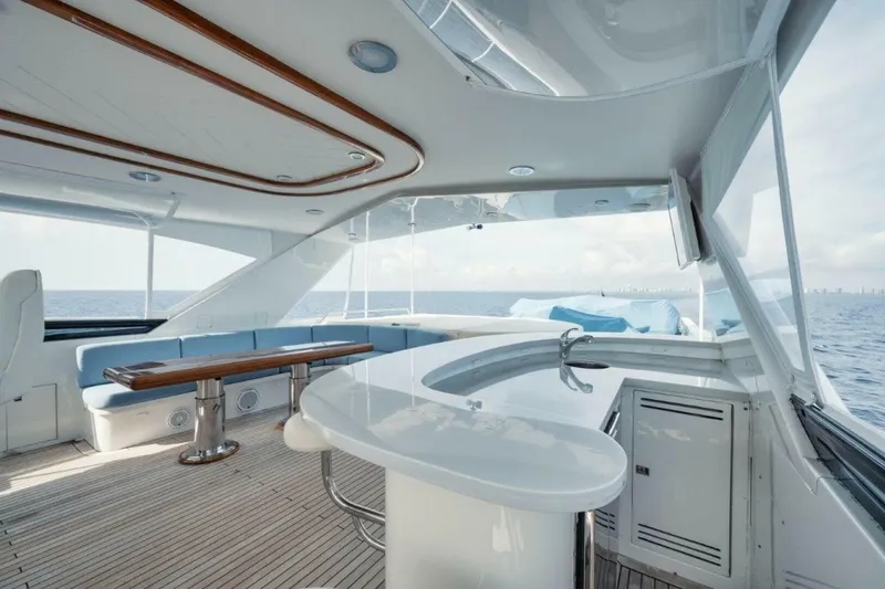 Slide: The Image of Luxurious 2002 Westport 112 yacht interior with elegant seating and ocean view. - 35