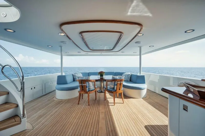Slide: The Image of Luxurious 2002 Westport 112 yacht deck with elegant seating and ocean view. - 30