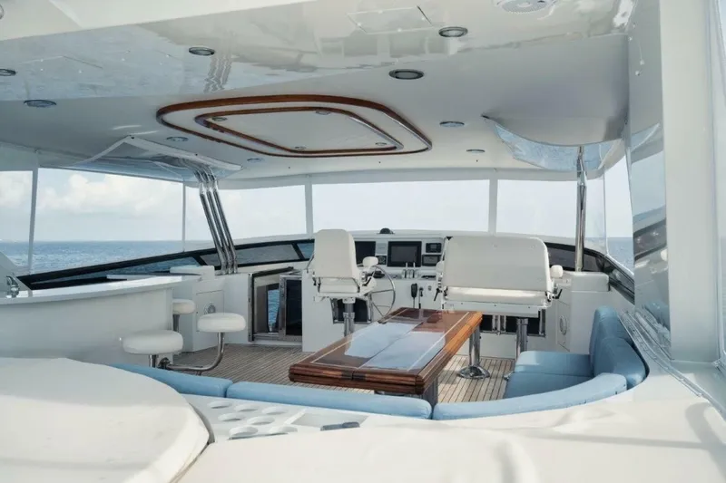 Slide: The Image of Luxurious 2002 Westport 112 yacht interior with helm, seating, and ocean view. - 39