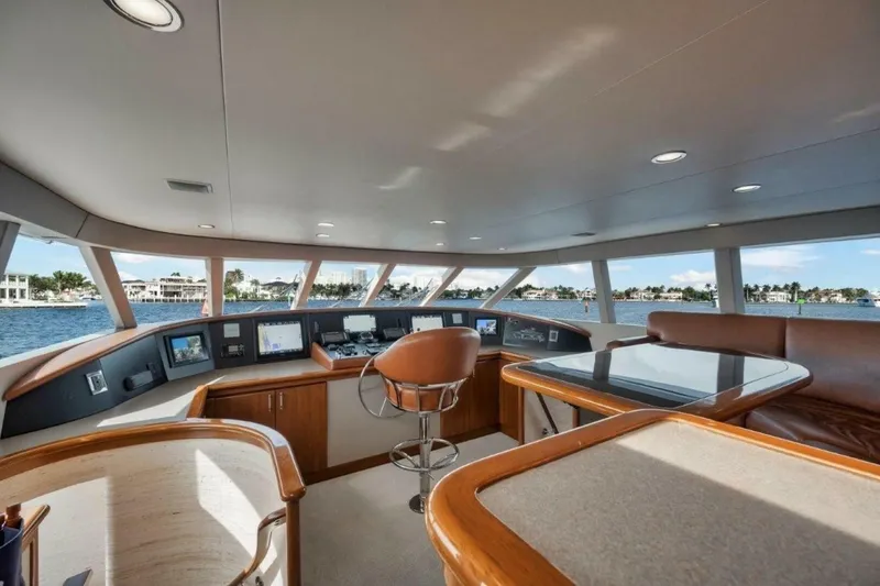 Slide: The Image of Luxurious interior of 2002 Westport 112 yacht with panoramic windows and modern navigation equipment. - 29