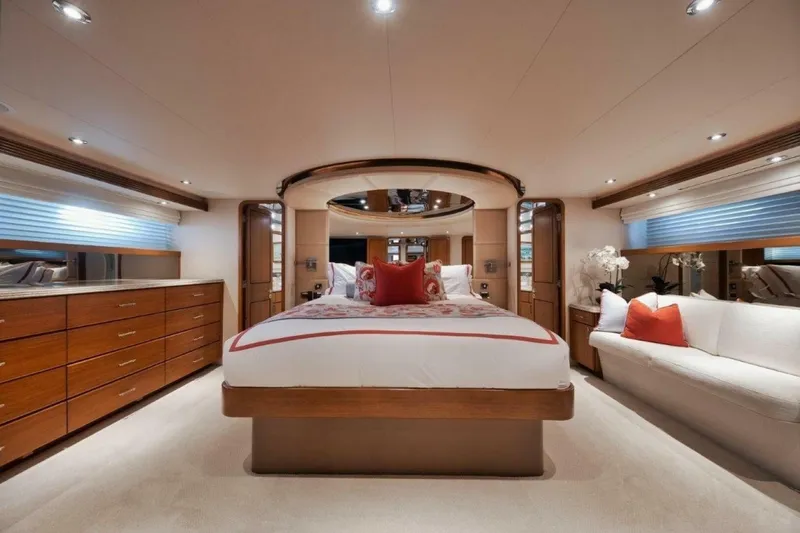 Slide: The Image of Luxurious bedroom interior of 2002 Westport 112 yacht with elegant wood furnishings and plush bedding. - 18