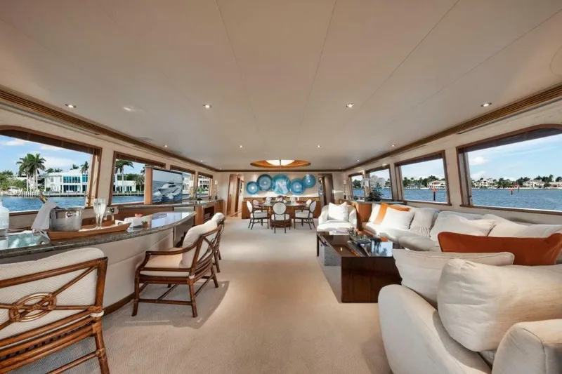 Slide: The Image of Luxurious interior of 2002 Westport 112 yacht with elegant seating and panoramic windows. - 14