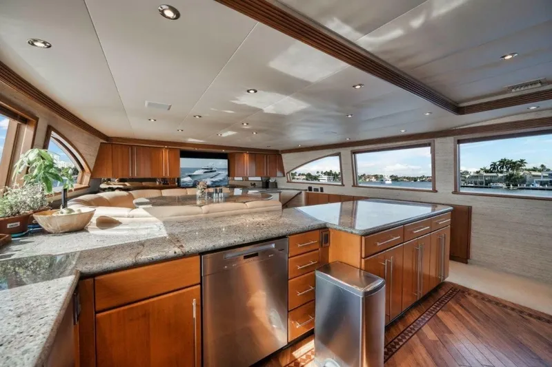 Slide: The Image of Luxurious interior of 2002 Westport 112 yacht with modern kitchen and panoramic windows. - 26