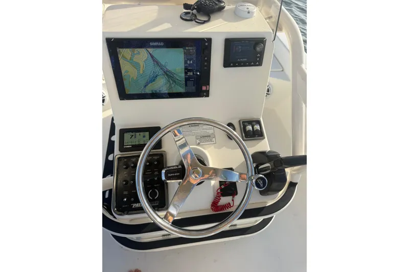 Slide: The Image of 2017 Pathfinder 2200 TRS boat console with navigation and control systems. - 17