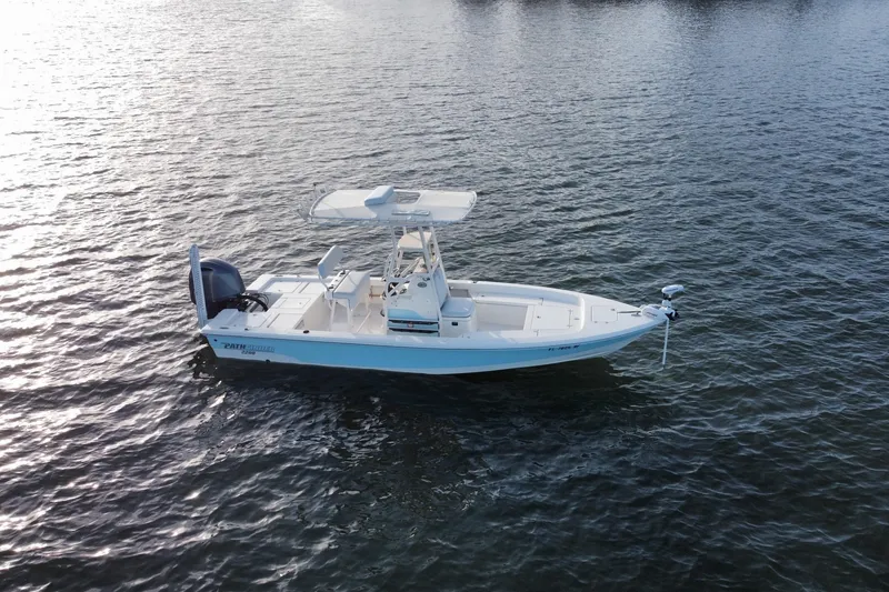 Slide: The Image of 2017 Pathfinder 2200 TRS boat on calm water, side view. - 5