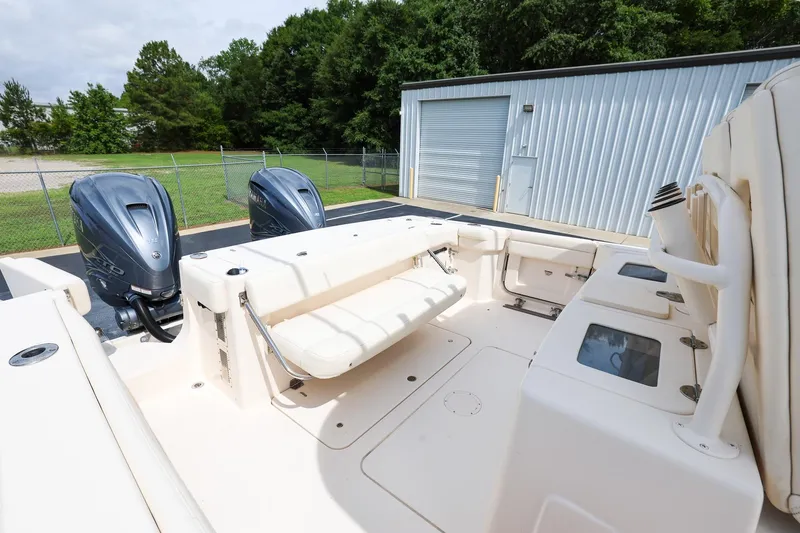 Slide: The Image of 2020 Grady-White Canyon 336 boat with dual outboard engines, spacious deck, and seating area. - 10