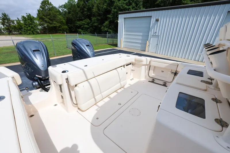 Slide: The Image of 2020 Grady-White Canyon 336 boat deck with dual outboard engines. - 11