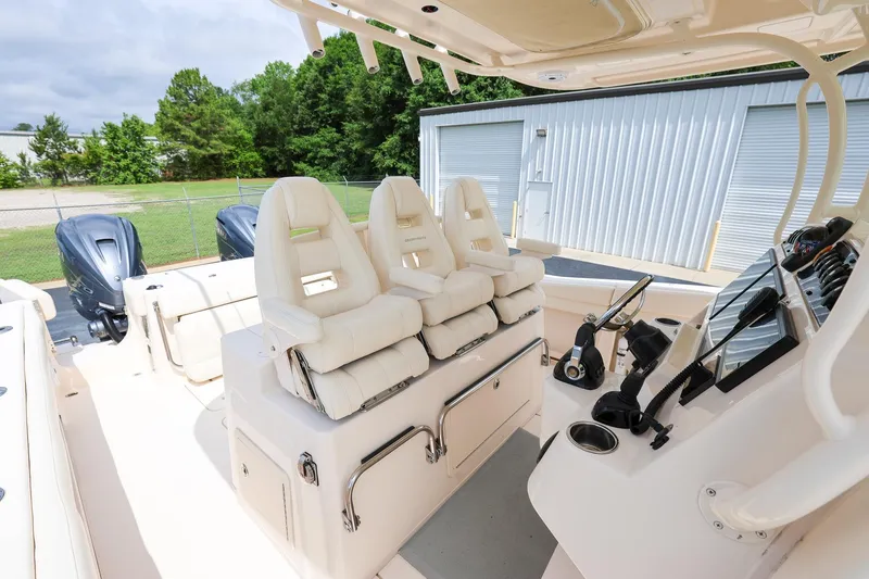 Slide: The Image of 2020 Grady-White Canyon 336 boat interior with helm and seating. - 14