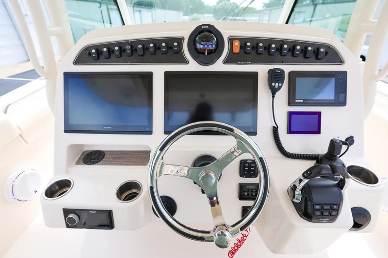 Slide: The Image of Control panel of a 2020 Grady-White Canyon 336 boat with advanced navigation systems. - 18