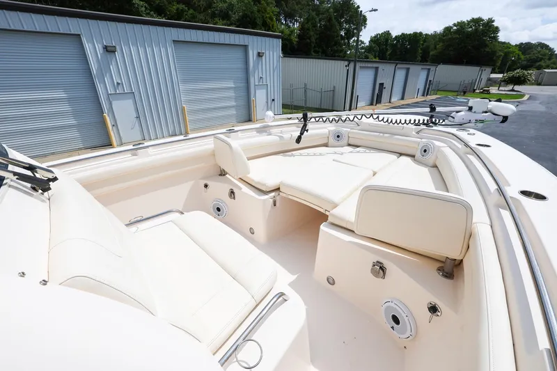 Slide: The Image of 2020 Grady-White Canyon 336 boat interior with cushioned seating and storage compartments. - 20