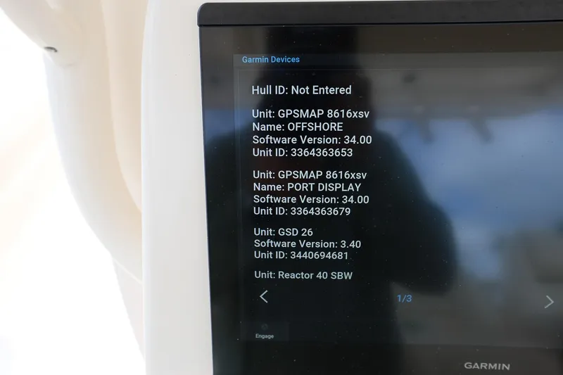 Slide: The Image of Garmin device display on 2020 Grady-White Canyon 336 boat, showing software and unit details. - 21