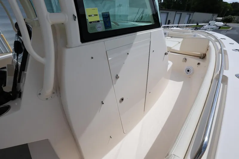 Slide: The Image of 2020 Grady-White Canyon 336 boat interior with storage compartments and seating. - 26