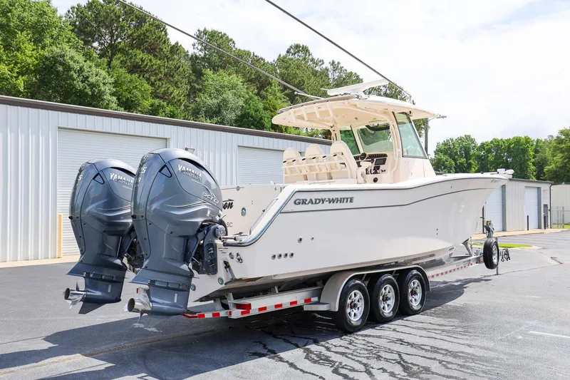 Slide: The Image of 2020 Grady-White Canyon 336 boat with dual Yamaha engines on a trailer. - 3