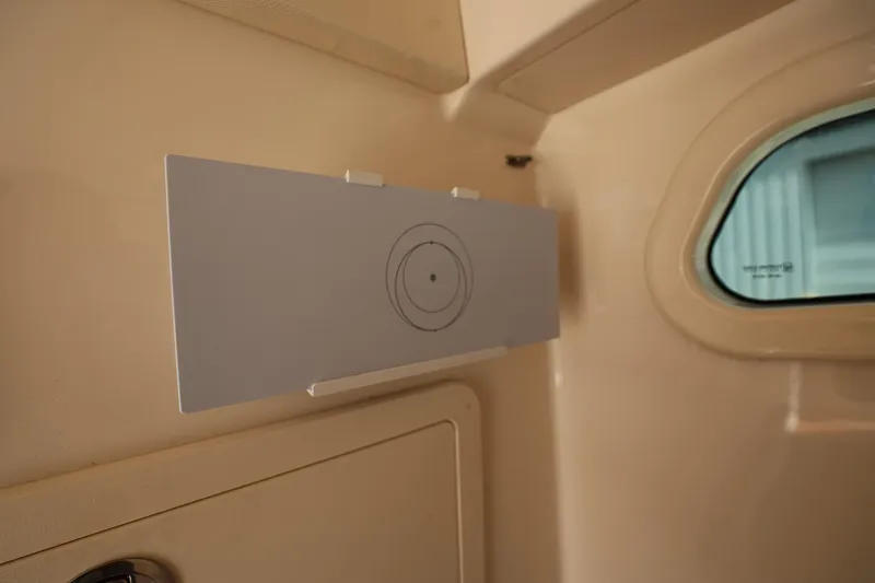 Slide: The Image of Interior detail of 2020 Grady-White Canyon 336 boat, featuring a mounted panel and window. - 31