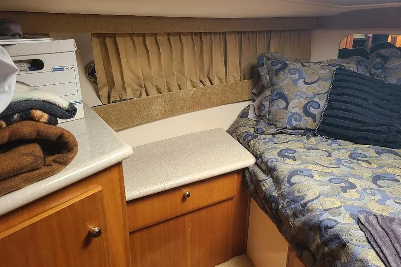 Slide: The Image of Cozy cabin interior of 2003 Carver 356 Aft Cabin Motor Yacht with patterned bedding. - 11