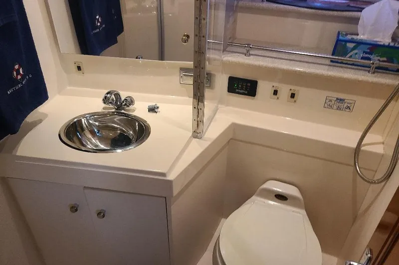 Slide: The Image of Bathroom interior of 2003 Carver 356 Aft Cabin Motor Yacht with sink and toilet. - 12