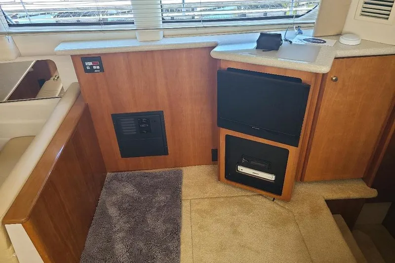 Slide: The Image of Interior of 2003 Carver 356 Aft Cabin Motor Yacht with TV and control panel. - 18