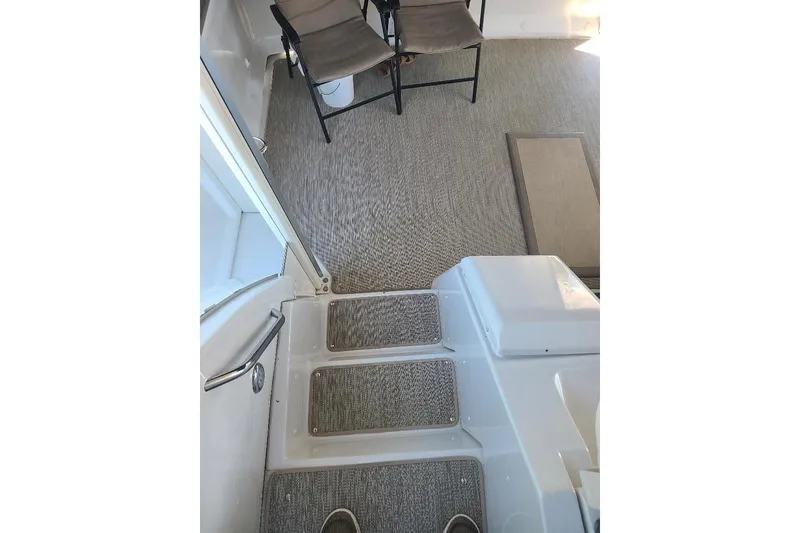 Slide: The Image of Interior view of 2003 Carver 356 Aft Cabin Motor Yacht with carpeted steps and seating area. - 31