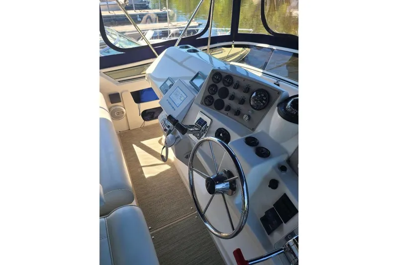 Slide: The Image of Helm of 2003 Carver 356 Aft Cabin Motor Yacht with steering wheel and control panel. - 33