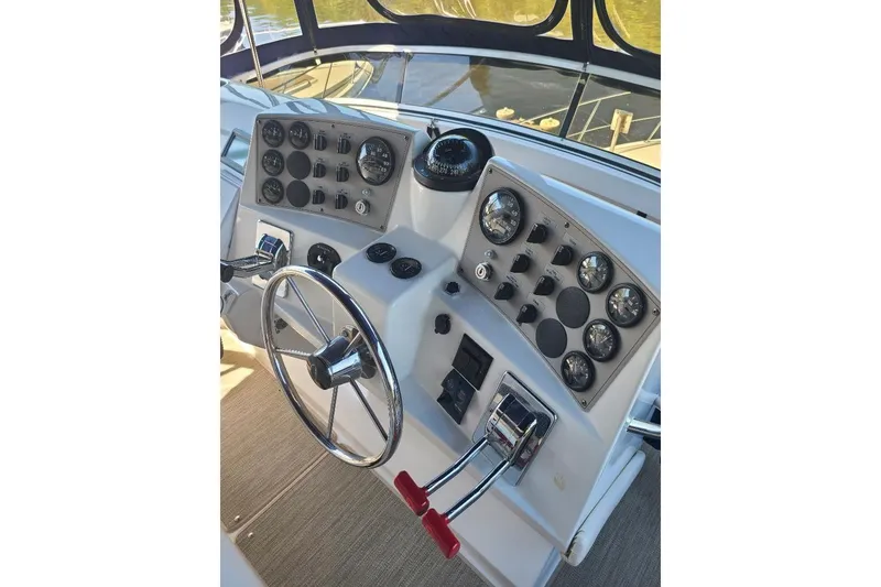 Slide: The Image of Helm of 2003 Carver 356 Aft Cabin Motor Yacht with steering wheel and control panel. - 34