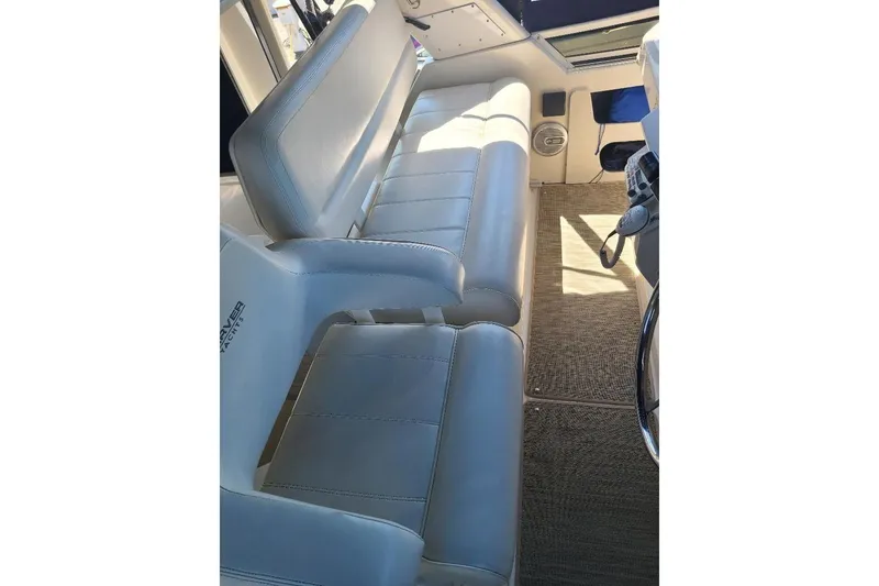 Slide: The Image of Interior seating of 2003 Carver 356 Aft Cabin Motor Yacht, featuring plush white upholstery. - 35