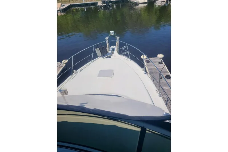 Slide: The Image of 2003 Carver 356 Aft Cabin Motor Yacht docked at a marina. - 36