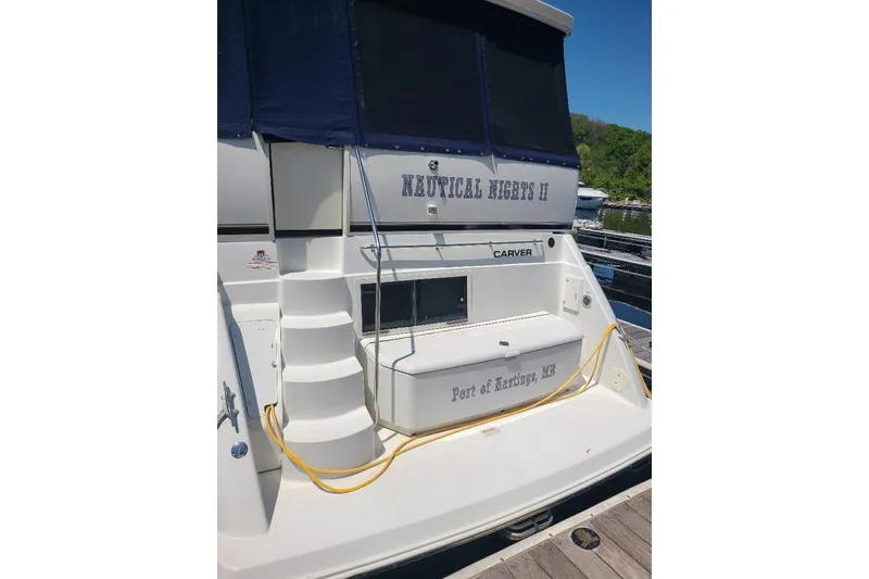 Slide: The Image of 2003 Carver 356 Aft Cabin Motor Yacht docked, featuring "Nautical Nights II" name. - 4