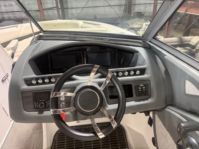 Slide: The Image of Dashboard of a 2017 Cobalt R7 boat with steering wheel. - 10