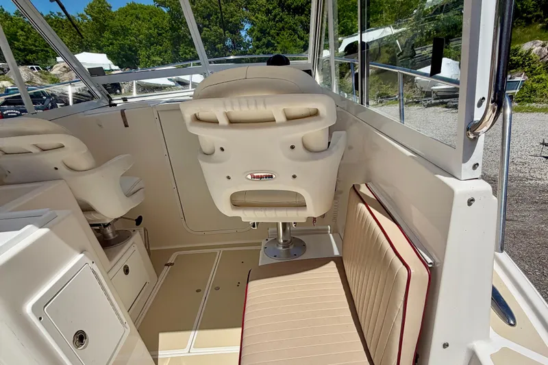 Slide: The Image of Interior of a 2007 NorthCoast 235 HT boat with seating and helm. - 11