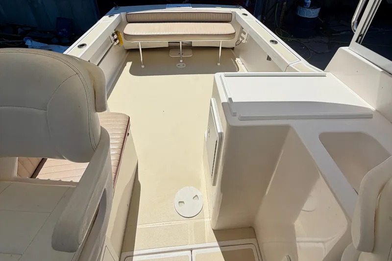 Slide: The Image of 2007 NorthCoast 235 HT boat interior with seating and storage compartments. - 14