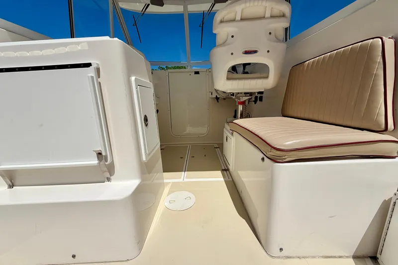 Slide: The Image of Interior view of a 2007 NorthCoast 235 HT boat, featuring seating and storage. - 15